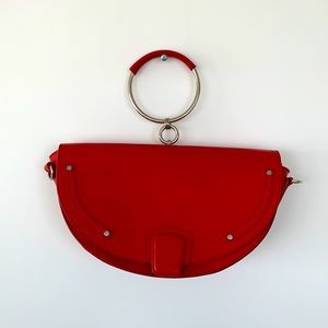 Half moon shaped red leather bag | l’intervalle